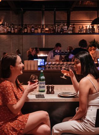 Friends enjoying food and drink at Parry Street Garage, Newcastle West