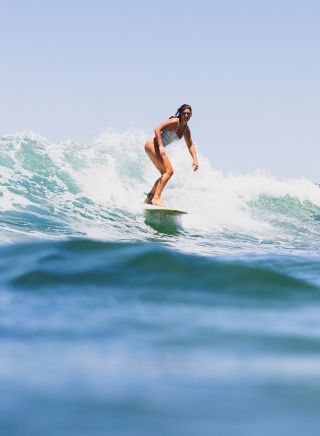 Surfer riding a wave, Bilgola Beach
