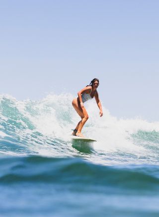 Surfer riding a wave, Bilgola Beach