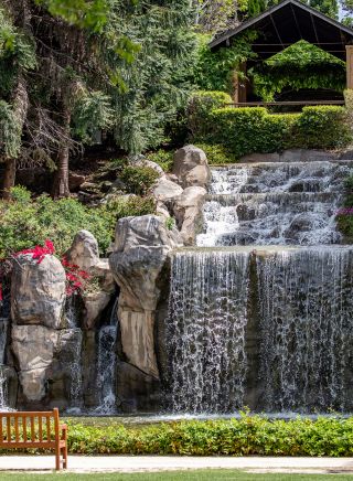 A majestic 10 metre high waterfall in the scenic Sunken Garden located at Hunter Valley Gardens, Pokolbin