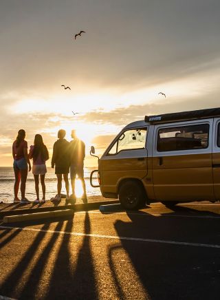 People with campervan at Main Beach, Byron Bay