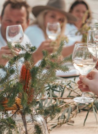 Group enjoying a dining experience on the White Sands Coast, Jervis Bay