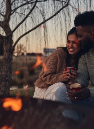 Couple enjoying campfire at Wilga Station, Evans Plains