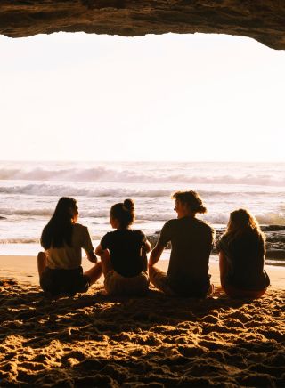 Four friends inside a cave, Caves Beach, Lake Macquarie