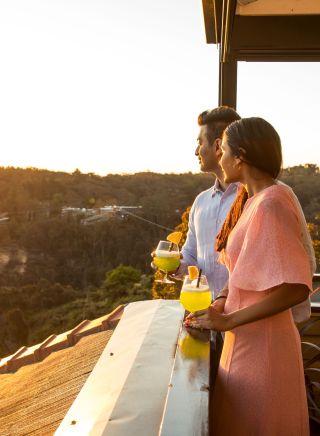 Couple enjoying a drink and views of the sun setting, Echoes Boutique Hotel and Restaurant, Katoomba