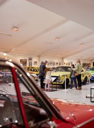 Family looking at race cars, The National Motor Racing Museum, Bathurst