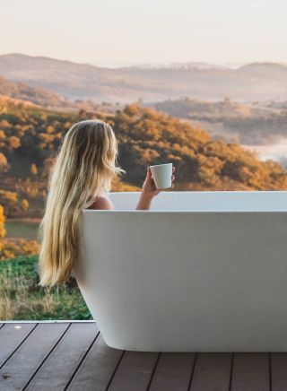 Woman enjoying her stay at Sierra Escape, Piambong near Mudgee
