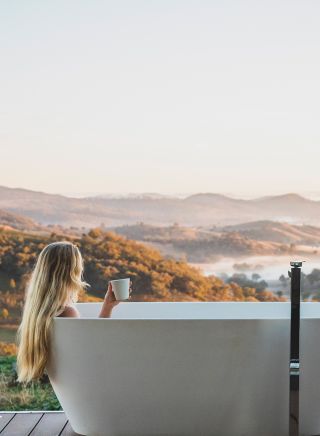 Woman enjoying her stay at Sierra Escape, Piambong near Mudgee