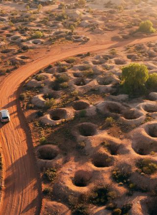 Scenic aerial overlooking a car driving, Scenic Drive, White Cliffs
