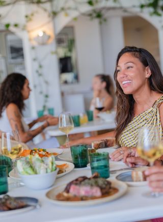 Friends enjoy a food and drink, Raes on Wategos, Byron Bay