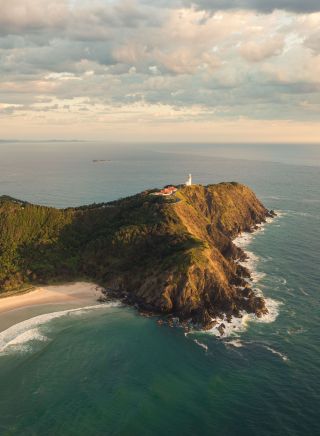 Aerial view at sunrise, Cape Byron Headland and Lighthouse, Byron Bay