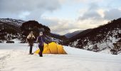 A couple snowshoeing by their campsite through Dead Horse Gap, Thredbo in the Snowy Mountains