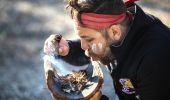 Aboriginal guide Dwayne Bannon-Harrison performing a smoking ceremony during a traditional welcome on a Ngaran Ngaran Culture Awareness tour