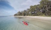 Mother and daughter kayaking along Sailors Beach near Moona Moona Creek in Huskisson, Jervis Bay