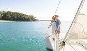 Couple enjoying a romantic day on the water with luxury sailing charter Discover Jervis Bay