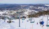 People enjoying a day of skiing and snowboarding at Blue Cow ski resort in Perisher, Kosciuszko National Park