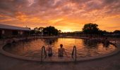 Couple enjoying a visit to the Lightning Ridge Bore Baths in Lightning Ridge, Outback NSW
