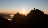 Hiker enjoying a scenic sun set from the top of a mountain at Kosciuszko National Park, Kosciuszko - Credit: Tourism Snowy Mountains