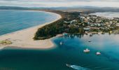 Aerial over Mitchies Jetty and Cafe on the foreshore of Merimbula Lake, Mitchies Jetty and Cafe, Merimbula