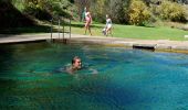 Man enjoys a swim at the thermal pools, Yarrangobilly Caves Thermal Pool, Yarrangobilly