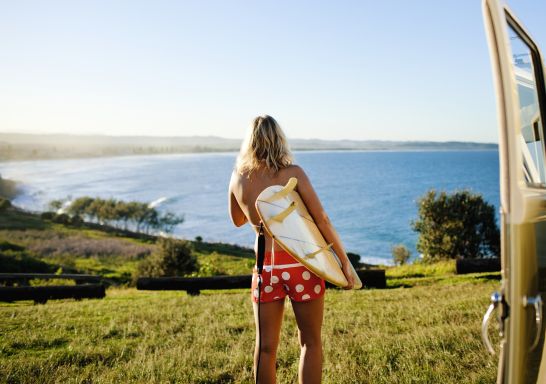 Surfer heading to the beach, Lennox Head, Northern Rivers