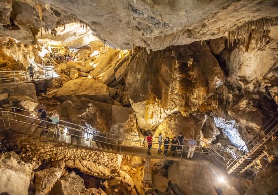 Small group enjoying a tour through a cave system at Jenolan Caves in the Blue Mountains