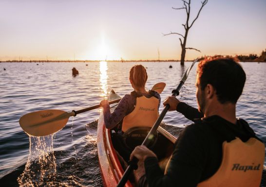 Couple enjoying an afternoon of kayaking along Lake Mulwala in Mulwala, The Murray