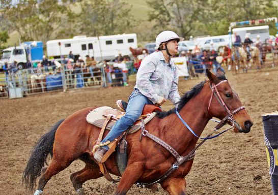 Woman riding a horse at The Annual Gresford Rodeo & Campdraft in Dungog,  Barrington Tops