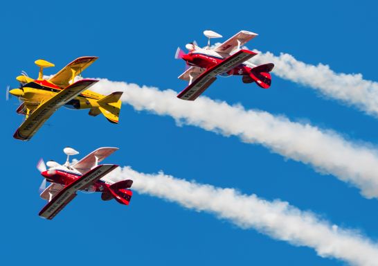 Classic aircraft performing aerobatic displays for crowds at the 2017 Wings Over Illawarra Event at Shellharbour Airport