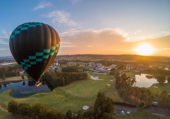 Hot air balloon over golf course in Lovedale, Hunter Valley