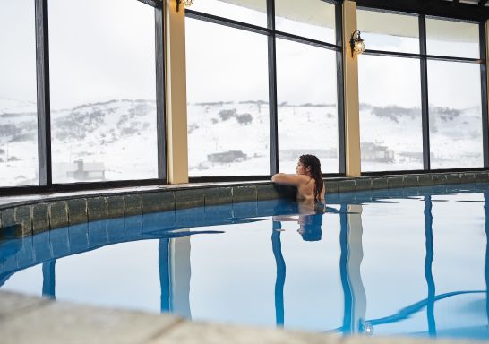 A woman enjoying a swim at Perisher's only heated pool in the Marritz Hotel
