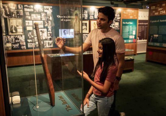 Father and daughter enjoying a visit to the Bradman Museum & International Cricket Hall of Fame, Bowral