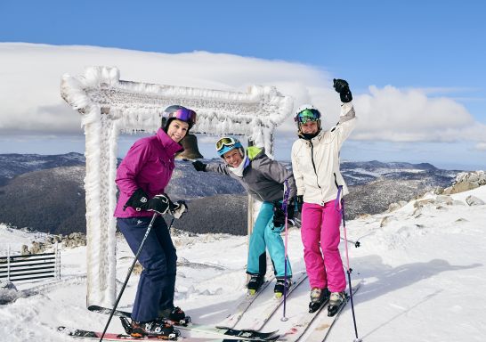 Skiers ringing the Thredbo Community Bell at Australia's Highest Lifted Point