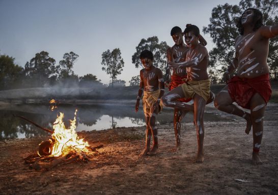 Males from the Barkindji nation dancing besides the Darling River in Wilcannia