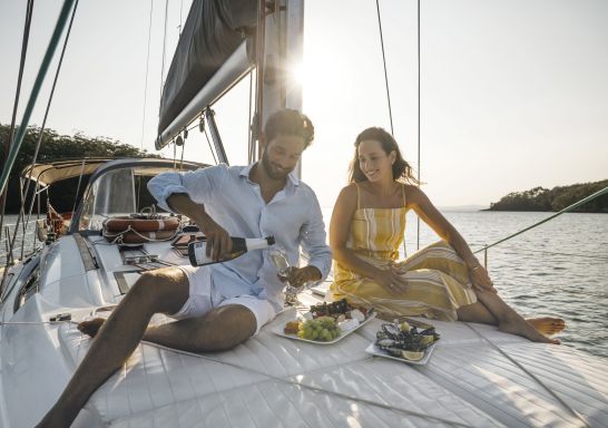 Couple enjoying a sailing experience in Fame Cove, Port Stephens