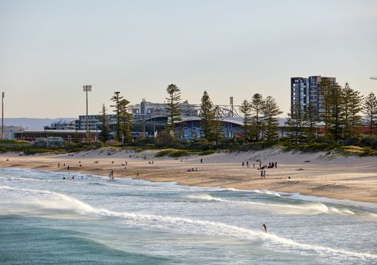 People enjoying the sand and surf at Main Beach, Wollongong