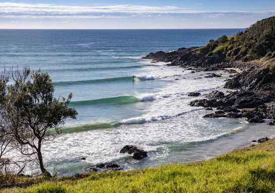  A lone surfer enjoys perfect waves at Crescent Head on the northern side of Racecourse Head.