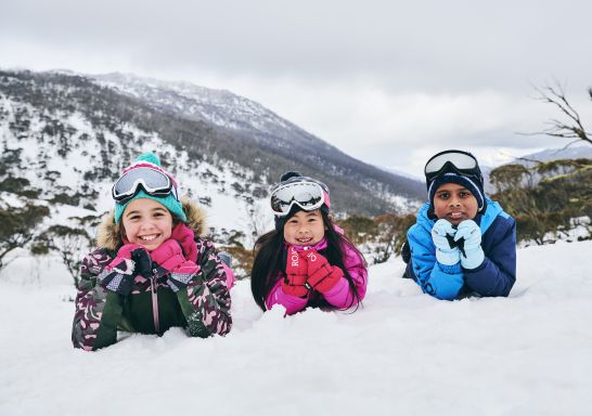 Children enjoying a fun day in the snow at Thredbo in the Snowy Mountains