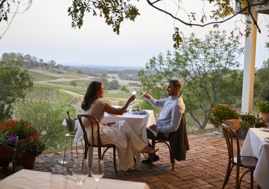 Couple enjoying food and drink at Bistro Molines in Mount View, Hunter Valley