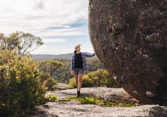 Woman with boulder, Cathedral Rock National Park, Ebor - Credit: Armidale Regional Council