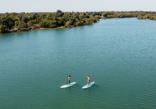 Couple enjoying a stand up paddleboarding experience, Fingal Head, Tweed